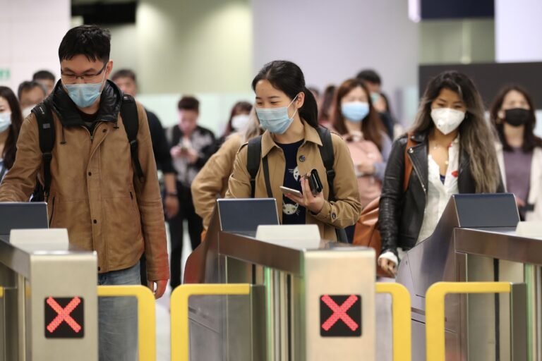 Travelers At Hong Kong Airport And West Kowloon Station As Virus Spreads to Hong Kong